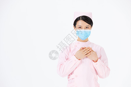女性护理双手放在胸前的护士背景