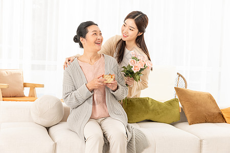 孩子礼物母亲节送花的母女背景