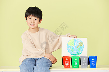 手绘儿童人物小男孩坐在垃圾分类桶旁背景