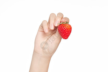 女性手拿草莓特写图片