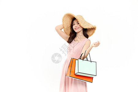 时尚女性戴草帽购物图片