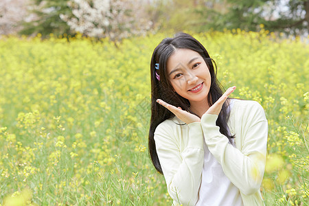 手绘花海油菜花花海中的可爱少女背景