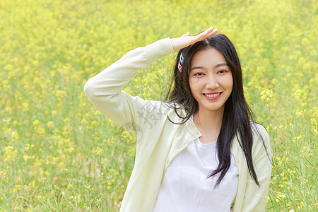 油菜花背景油菜花田花季少女背景