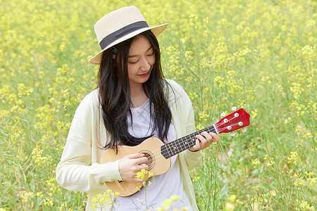 油菜花田的女孩春季油菜花田可爱少女背景