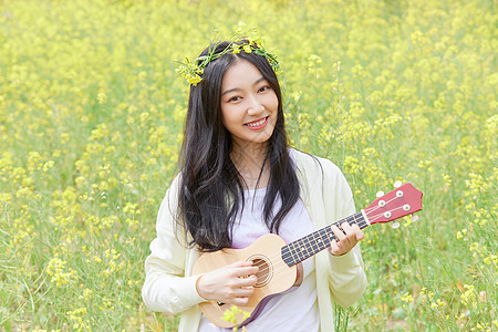 阳光女孩春季油菜花田可爱少女背景