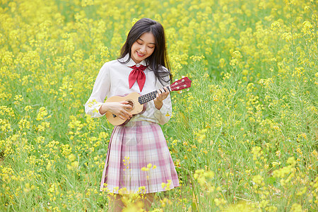 美女模特春季油菜花田可爱少女背景