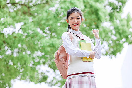 高考冲刺学生为高考加油的年轻女生背景