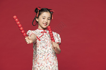 简约女孩红色背景中国风旗袍儿童手拿冰糖葫芦背景
