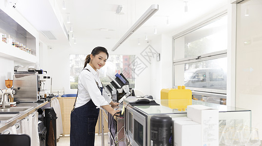 饮品店前台女性服务员图片