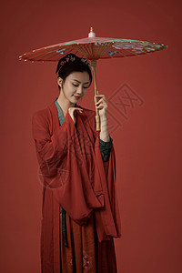 古装唐朝服饰美女撑着伞背景图片
