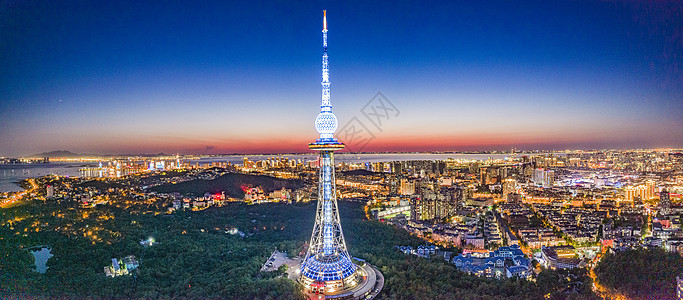 青岛晚霞航拍全景青岛电视塔及城市夜景背景