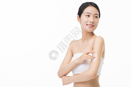 女性身体夏日美女涂身体乳防晒霜背景