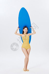 拿冲浪板的泳装美女形象图片