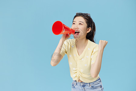 女神节宣传可爱美女拿喇叭喊话背景