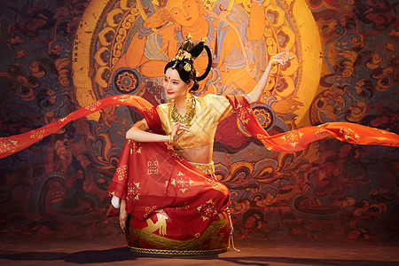 中国风人像敦煌美女坐在大鼓上跳舞背景