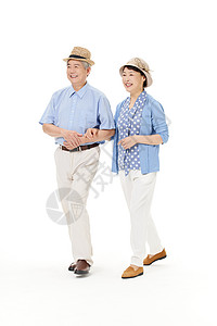 老年夫妻挽着手走路高清图片