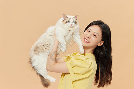 美女和猫美女主人和宠物猫咪欢乐相伴背景