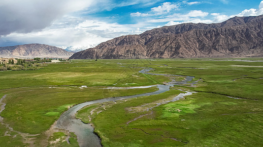 昆仑山脉航拍5A新疆帕米尔旅游景区景点金草滩背景