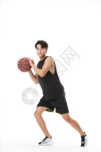 打篮球的男性形象背景图片