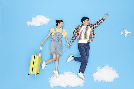 创意情侣旅行创意俯拍情侣云朵上飞行旅游背景