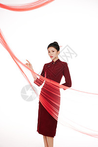 春节风素材红色飘带背景中的旗袍美女形象背景