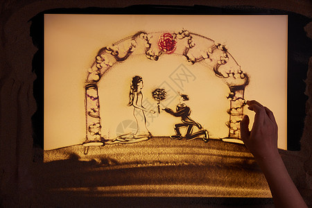 手绘沙画新郎向新娘求婚献花背景图片