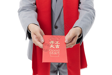 商务男性过新年送红包特写图片