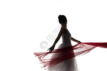 手拿红绫丝带跳舞的女性剪影背景图片