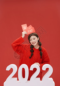 春节女性手拿红包跨年形象背景