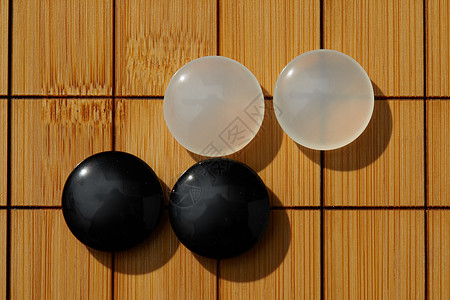 围棋盘上的黑白棋子背景图片