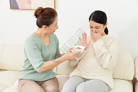 卧室人年轻准妈妈孕期食欲不振背景