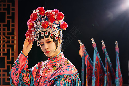 花鼓戏武旦脸谱国粹戏曲京剧旦角美女整理妆容背景
