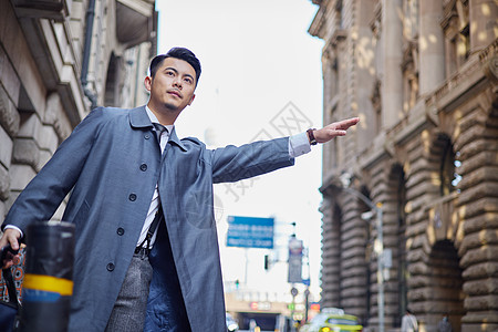 职场精英都市白领路边拦车手势背景