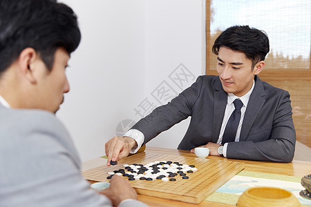 喝茶下棋商业人士在茶室下棋背景