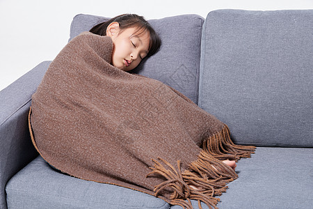 儿童生病发烧流感躺在沙发上睡觉图片