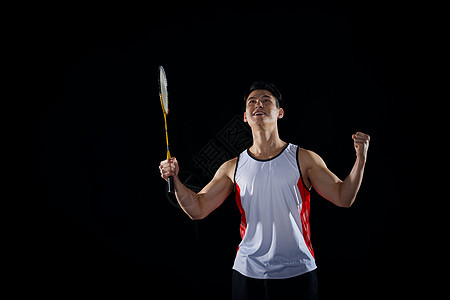 打羽毛球的男性运动员形象背景图片