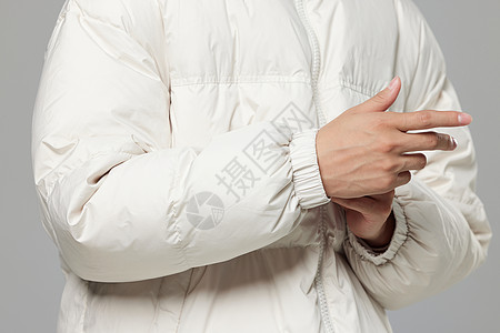 冬日保暖白色羽绒服袖子细节特写背景