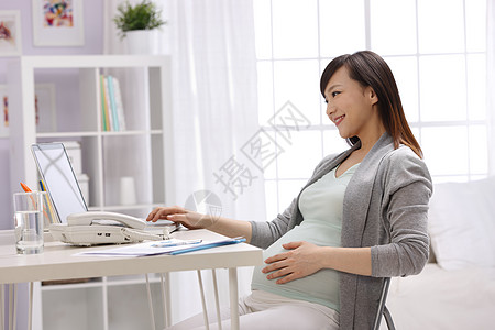 办公室女性居家幸福的孕妇背景