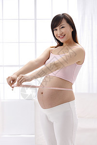 摄影时尚控制孕妇测量腰围图片