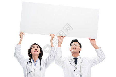 外科医生高举白板的青年医生图片