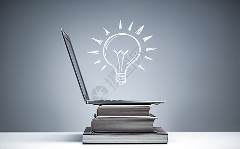 科技创意灯泡书和笔记本电脑和灯泡图像背景