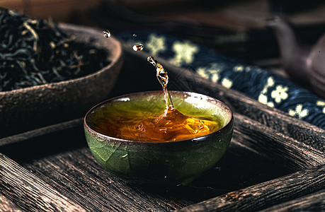 传统文化元素一杯茶和茶叶图片