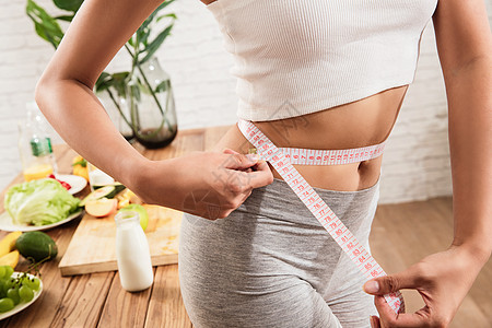 新鲜到家健康女人测量腰围背景