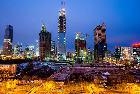 工地夜景城市CBD的摩天大楼景象背景