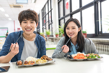 智慧旅游大学生在食堂里用餐背景