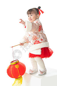 休闲活动可爱的站着一个小女孩手提红色灯笼庆祝新年图片