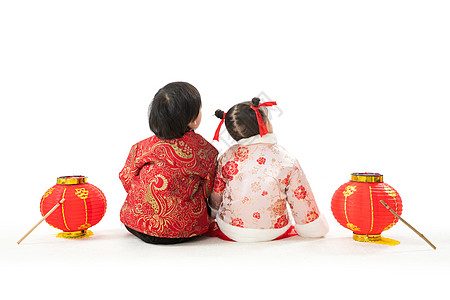 幸福背影愿望春节彩色图片庆祝新年的两个小朋友坐在地上背影背景