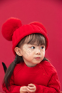 红衣小女孩人放松传统庆典穿红衣戴红帽的可爱小女孩背景