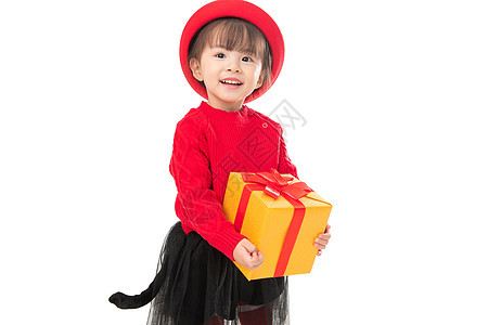 包装盒不看镜头拜年可爱的小女孩拿着新年礼物图片