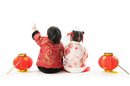 方向文化可爱的庆祝新年的两个小朋友坐在地上玩耍图片